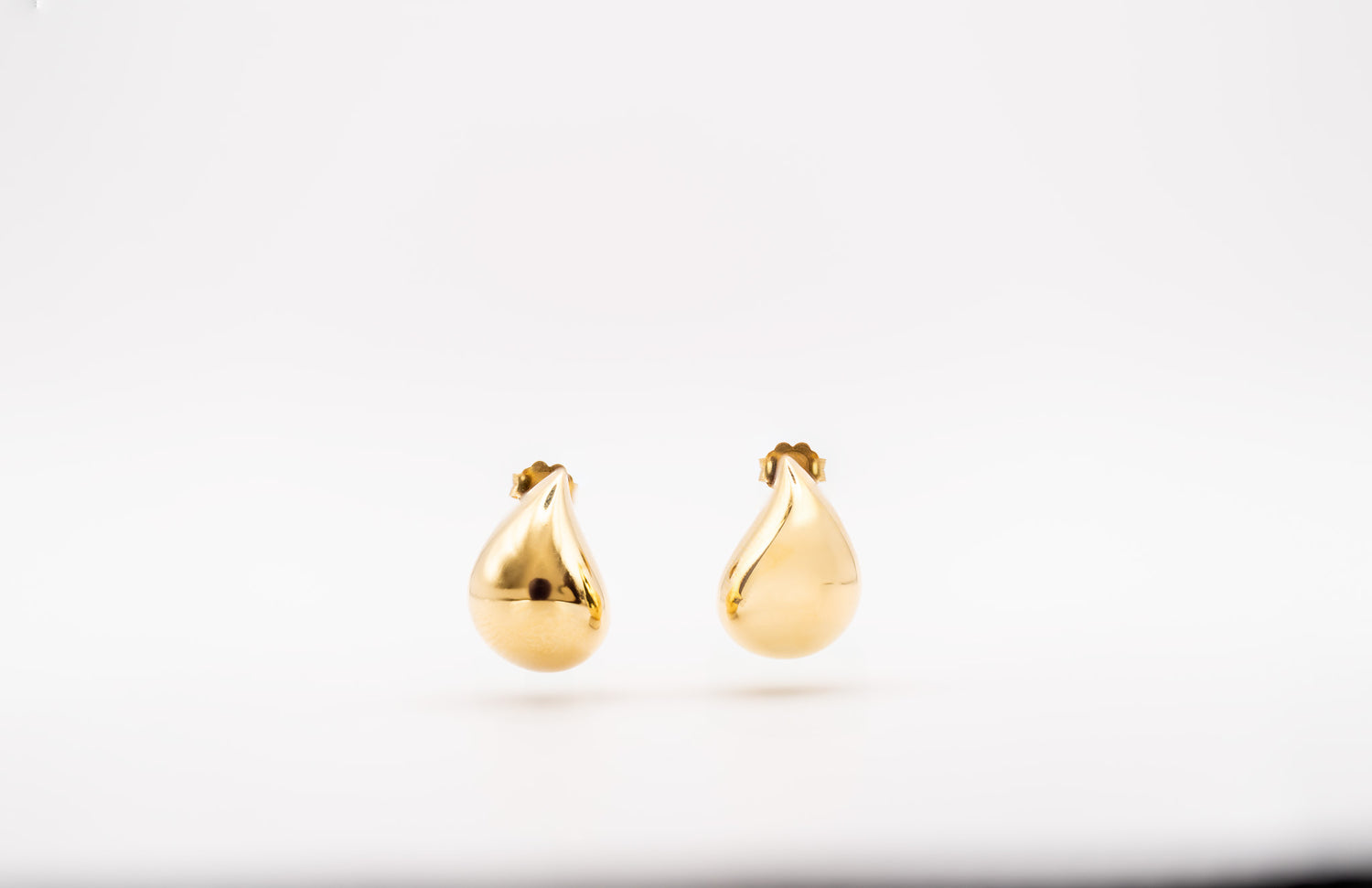Golden Droplet Statement Earrings